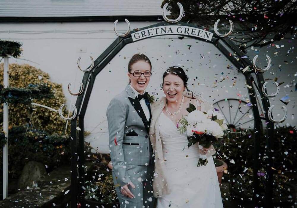 Wedding photo at the Kissing Gate Arch in Gretna Green